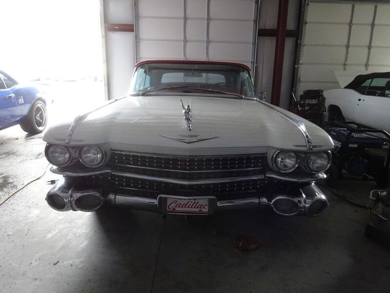 White Cadillac convertible classic car.
