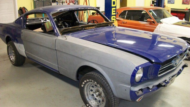 Partially primed Mustang with blue hood