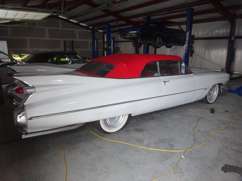 White vintage Cadillac convertible in garage