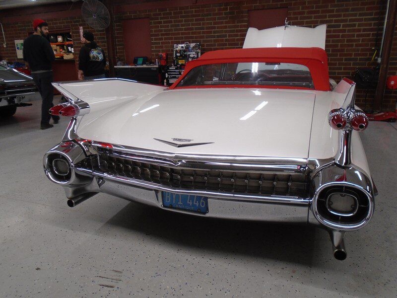 White Cadillac convertible rear view.