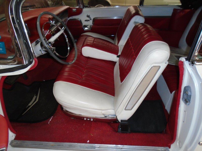 Red and white Cadillac convertible interior.