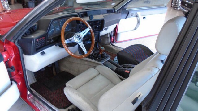 Red BMW interior, leather seats.
