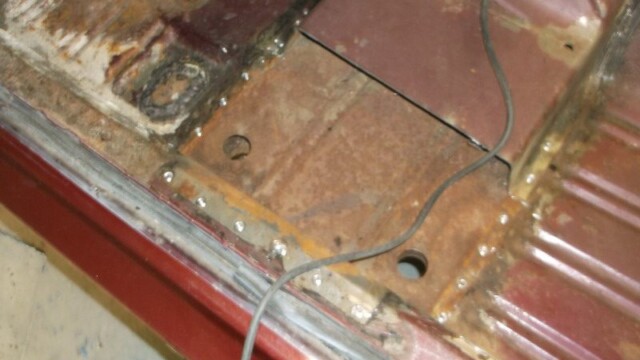 Rusty car floor panel repair welding.