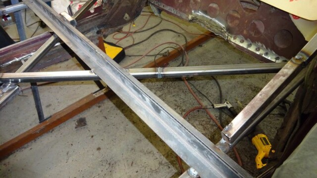 Welded square-tube chassis with tools nearby