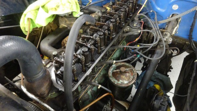 Dirty engine undergoing maintenance.