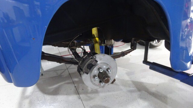 Blue car's rear suspension and brake.