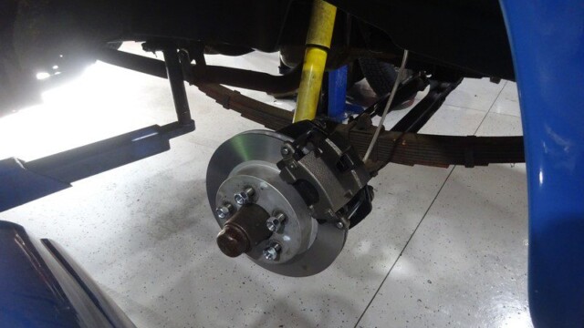 Car's disc brake and suspension detail.