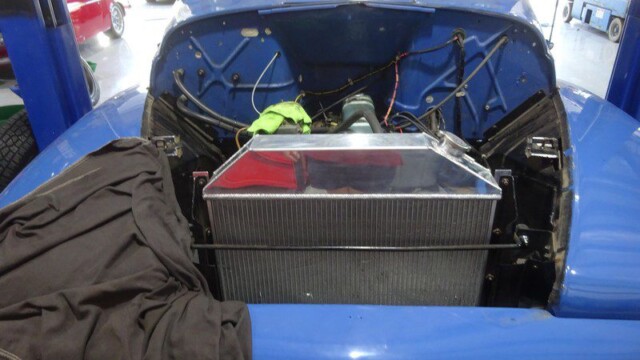 Blue classic car's new radiator.