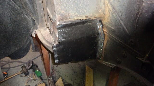 Car body repair: welded metal patch.