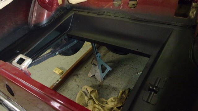 Classic car trunk under restoration.