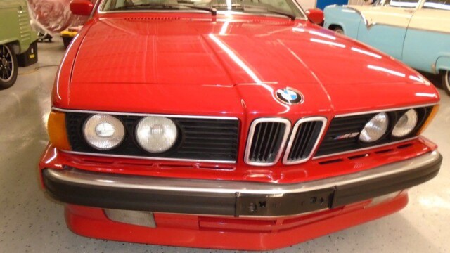 Red BMW M635CSi front view.