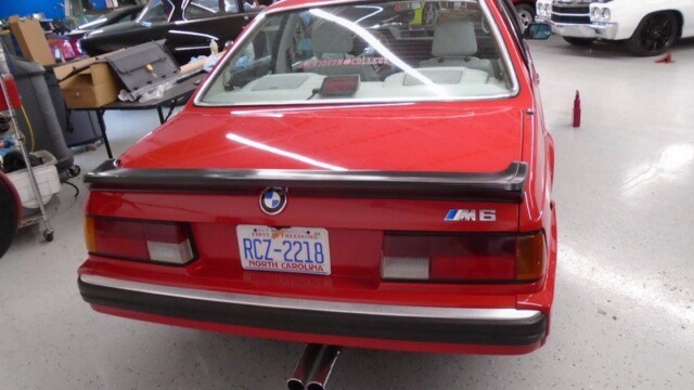 Red BMW M6 rear view, North Carolina plate.