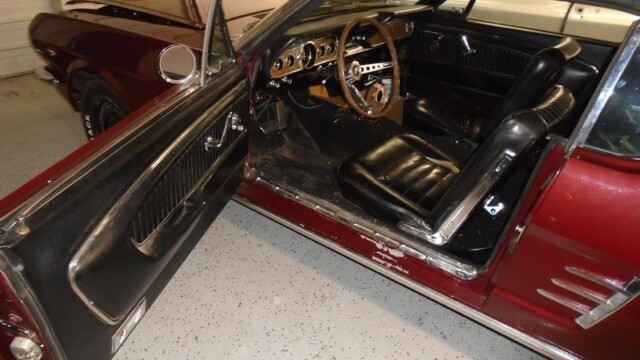 Red classic Ford Mustang convertible interior.