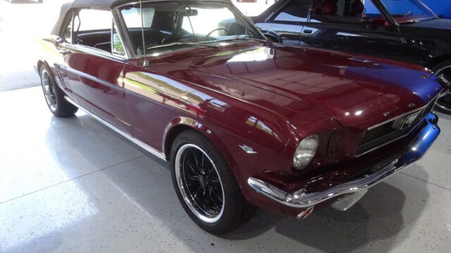 Maroon classic Ford Mustang convertible.
