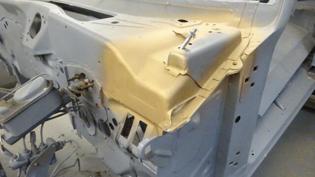 Car body restoration: painted dashboard section.