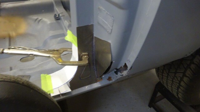 Car body repair, panel replacement in progress.