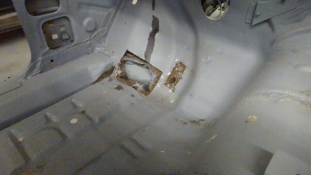 Car floor panel with rust repair.