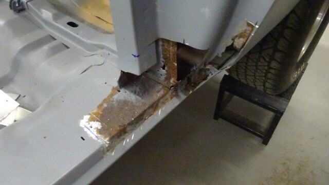 Rusty car body rust repair needed.