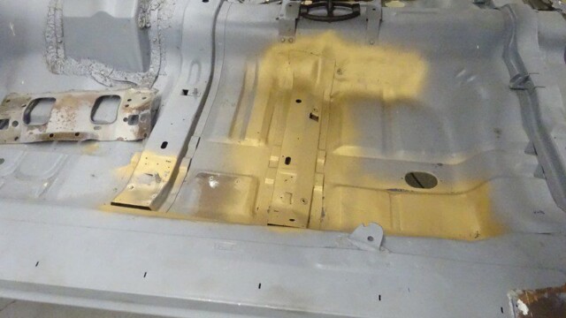 Car floor panel restoration in progress.