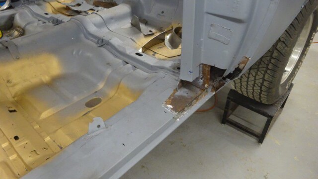 Interior floor pan with rusted rocker cutout