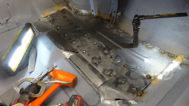 Clamped floor patch with tack welds and tools