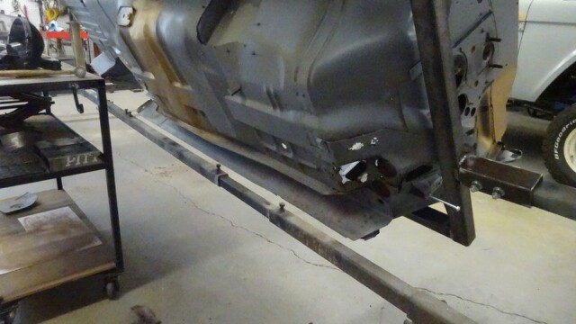Car body panel on repair stand.