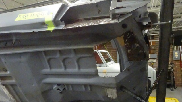 Car body panel undergoing repair.