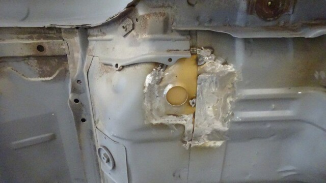 Car body repair: welded floor panel.