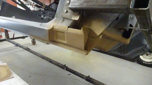 Car body repair; undercarriage panel replacement.