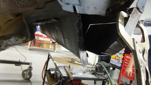 Car body repair, metal panel clamped.