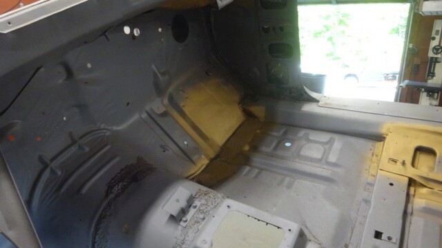 Primed interior floor pan with welded patchwork