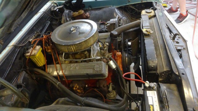 Orange small-block engine with chrome filter