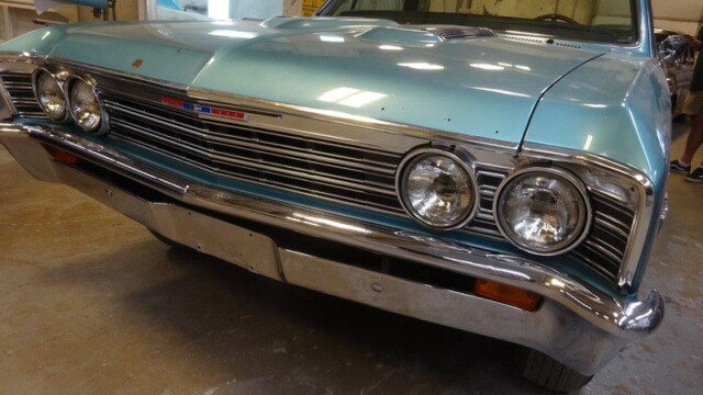 Here's an alt tag for the image: Vintage light blue Chevrolet El Camino.