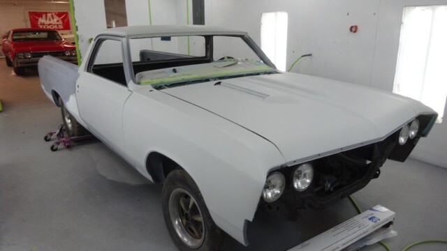 White classic truck in paint booth.