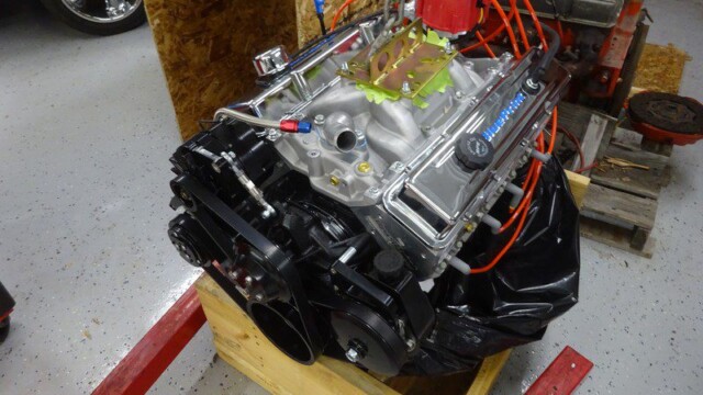 Small block Chevy engine in wooden crate.