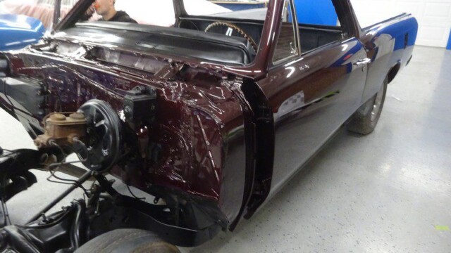 Maroon classic El Camino under restoration.