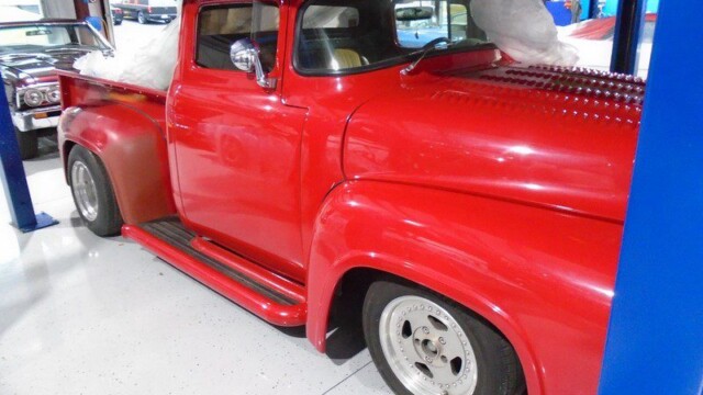 Red classic Ford pickup truck.