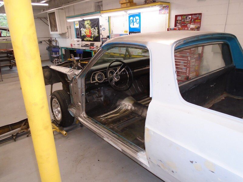 Ranchero interior with door removed in shop