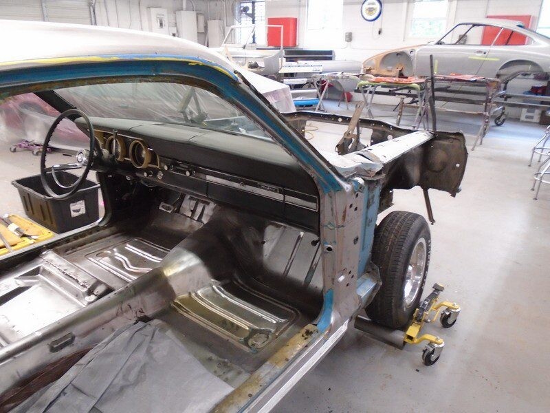 Stripped interior and dashboard in workshop
