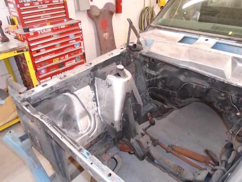 Bare engine bay with workshop toolbox