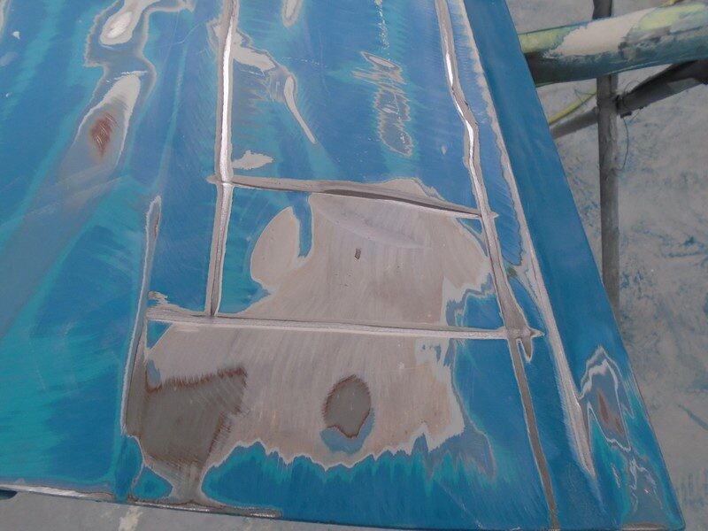 Blue surface with repaired damage.