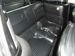 Black leather back seats in classic car.