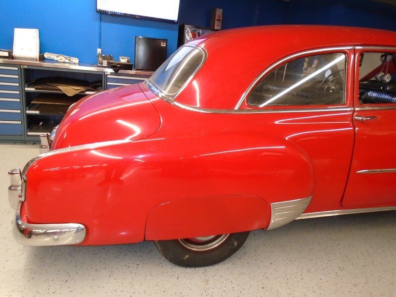 Red classic car, rear view.