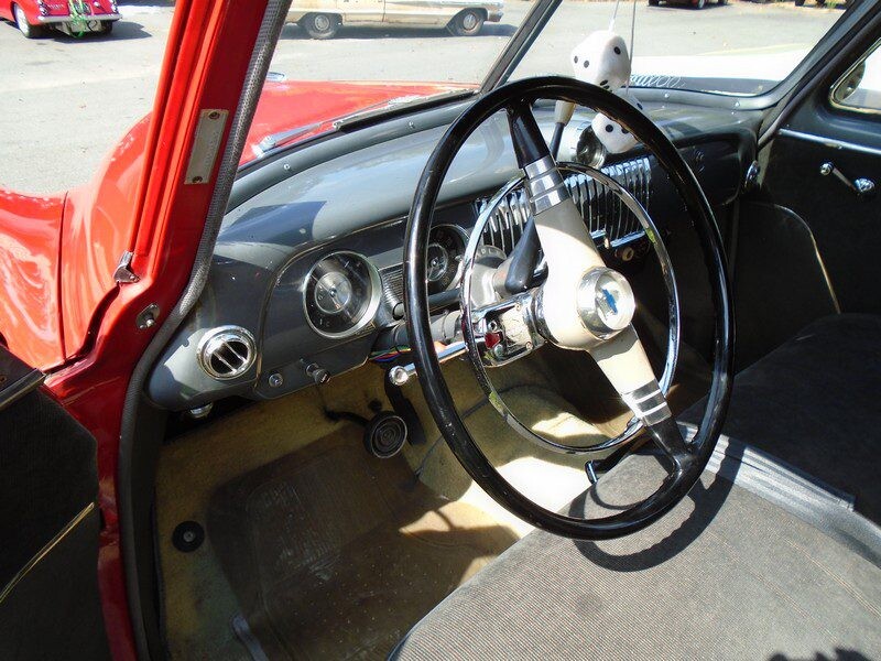 Red classic car interior dashboard.