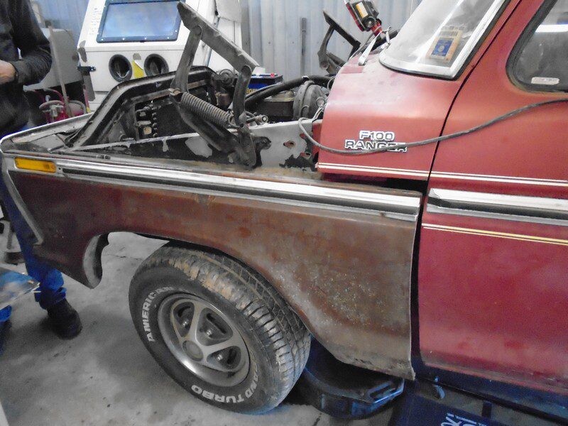 Rusty red Ford F100 Ranger truck.
