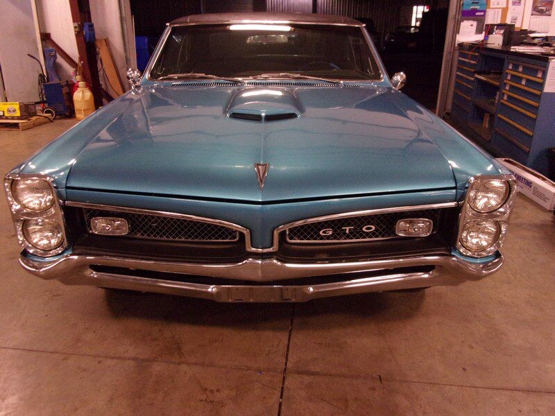 Blue Pontiac GTO classic car front.
