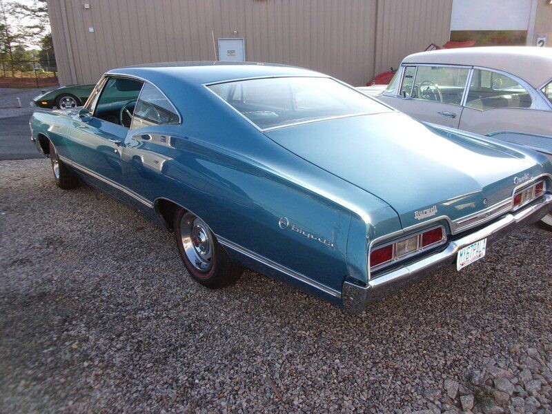 Blue 1966 Chevrolet Impala coupe.