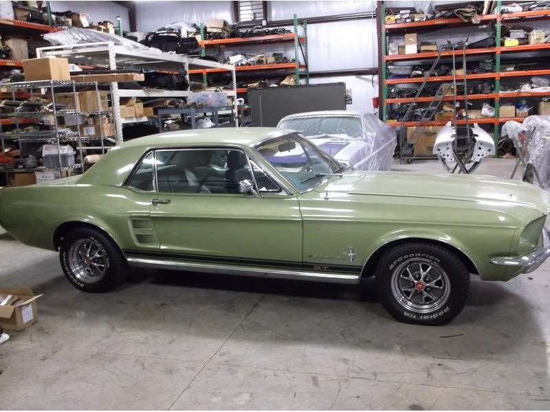 Here's an alt tag for the image: Green 1967 Ford Mustang GT fastback.