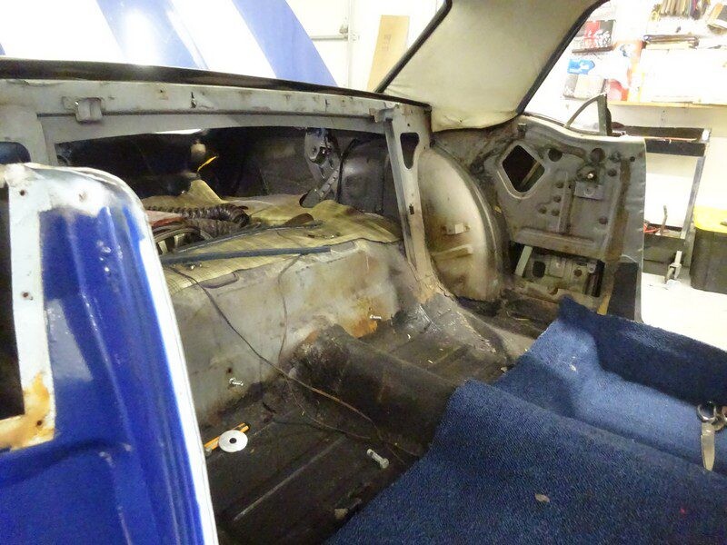 Exposed trunk and fuel area, carpet removed