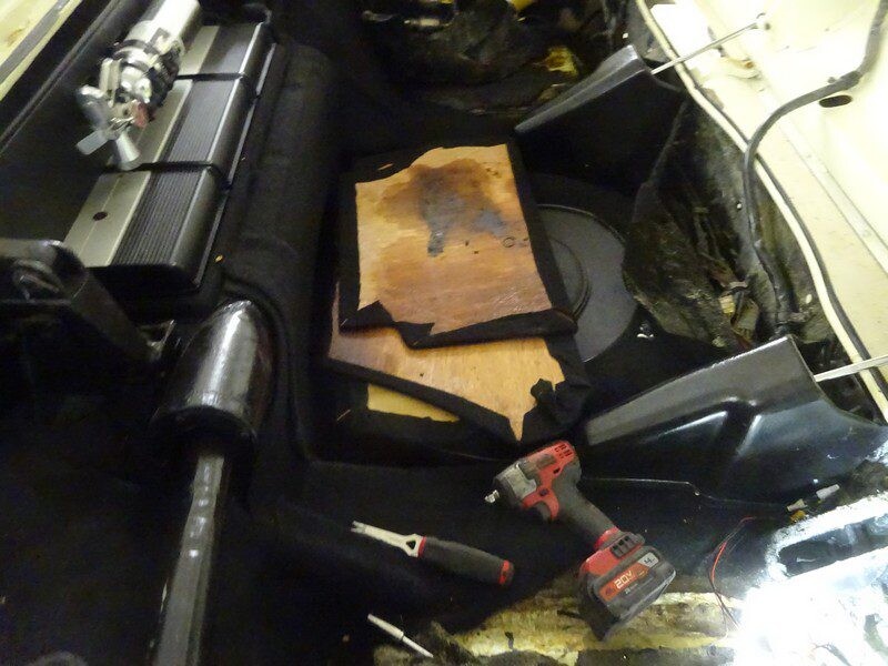 Car trunk repair, tools, and parts.